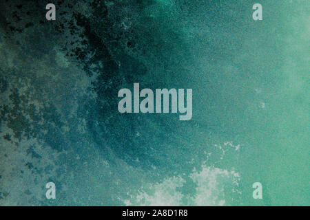 teal blue abstract background with dried watercolor painting on glass surface, abstract ocean wave Stock Photo
