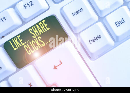 Conceptual hand writing showing Like Share Clicks . Concept meaning Content Marketing to Increase Engagement Social Media White pc keyboard with note Stock Photo