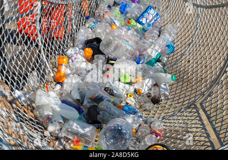 Close up of drink food containers inside Fin the Fish bin for plastic waste rubbish recycling on the seafront Scarborough North Yorkshire England UK Stock Photo