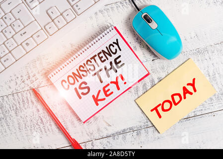 Word writing text Consistency Is The Key. Business photo showcasing by Breaking Bad Habits and Forming Good Ones Writing equipments and computer stuff Stock Photo