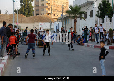 A Palestinian boys practice roller Skate on the streets of Khan Younis in the southern Gaza Strip, on November 7, 2019. Photo by Abed Rahim Khatib/Ala Stock Photo