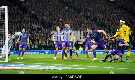 Celtic's Christopher Jullien (right) watched as his header is saved by Hibernian goalkeeper Chris Maxwell during the Scottish Betfred Cup Semi Final match at Hampden Park, Glasgow. Stock Photo