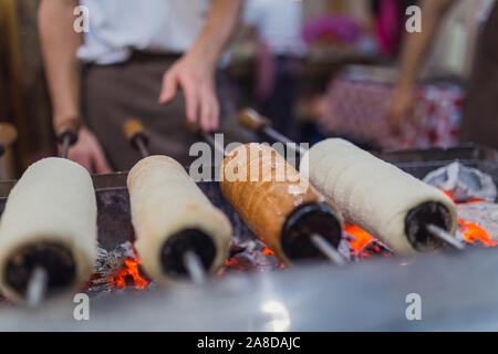 Preparation of the famous, traditional and delicious Hungarian Chimney Cake Stock Photo