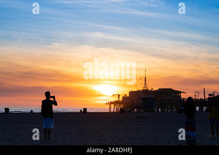 People on Santa Monica beach waiting to photograph the sunset, , Los Angeles County, California, United States of America Stock Photo