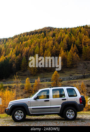 A driving journey on a Jeep KJ Liberty 2002 Cherokee Sport a 4x4 Off-roader car drive in the mountains to explore and discover stunning landscapes Stock Photo