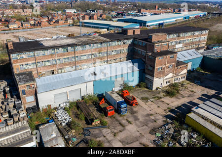 Aerial, overhead views of an abandoned factory, left to decline in the poor city of Hanley, Stoke on Trent, located right next to a busy motorway Stock Photo