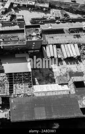 Aerial, overhead views of an abandoned factory, left to decline in the poor city of Hanley, Stoke on Trent, located right next to a busy motorway Stock Photo