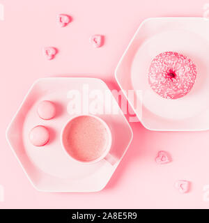 Breakfast with coffee on a pastel pink background. Flat lay, top view. Stock Photo