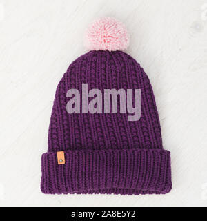 cute cozy knitted children winter hat Stock Photo