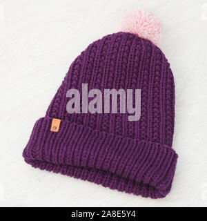 cute cozy knitted children winter hat Stock Photo