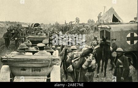 British soldiers on the Western Front, Belgium, First World War, 1917, (c1920). 'On the Way to the Fighting Zone: busy scenes on the Pilkem road'. Columns of vehicles and troops, Red Cross ambulances, and horses and mules. During the Battle of Pilckem Ridge, 31 July-2 August 1917,  the Anglo-French armies captured Pilckem (Flemish: Pilkem) Ridge and areas on either side. From &quot;The Great World War: A History&quot;, Volume VII, edited by Frank A Mumby. [The Gresham Publishing Company Ltd, London, c1920] Stock Photo