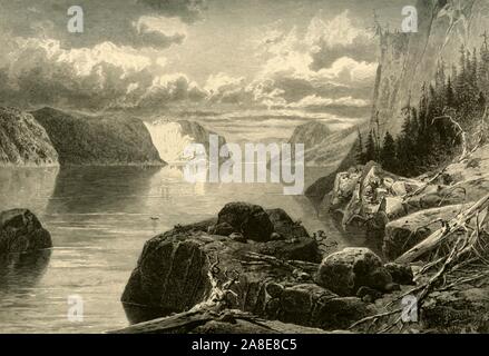 'Point Noir, Trinity Rock, and Cape Eternity, Saguenay River', 1874. The banks of the Saguenay River, Quebec, Canada. 'For the rest of the day we are toiling through like wildernesses of bowlders, precipices, and mountains. We bid adieu to Trinity and Eternity at Point Noir, thread the desolate mazes of St. Louis Island, and soon are passing Point Crepe, where the rocks, the everlasting rocks, look in the distance like the channel of a dried-up cataract'. From &quot;Picturesque America; or, The Land We Live In, A Delineation by Pen and Pencil of the Mountains, Rivers, Lakes...with Illustration Stock Photo