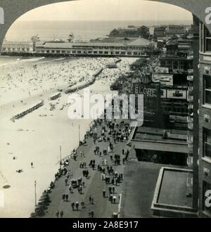 'Atlantic City, N.J., America's Foremost Seaside Resort - the Boardwalk and Steel Pier from the Breakers Hotel', c1930s. During Prohibition (1919-1933)  liquor was consumed and gambling regularly took place in the back rooms of nightclubs and restaurants in Atlantic City. From &quot;Tour of the World&quot;. [Keystone View Company, Meadville, Pa., New York, Chicago, London] Stock Photo