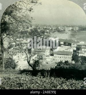 'The Great City of Bombay, the Metropolis of Western India, from Malabar Hill', c1930s. View of Chowpatty beach from Malabar Hill, a residential neighbourhood in Mumbai, Maharashtra on the Arabian Sea. From &quot;Tour of the World&quot;. [Keystone View Company, Meadville, Pa., New York, Chicago, London]