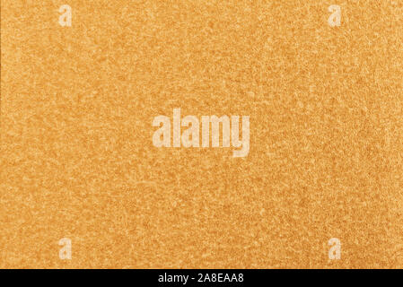 Gold paper with abstract texture for background. Paper for interior and exterior decoration or background for handcrafts. Gold paper background. Stock Photo