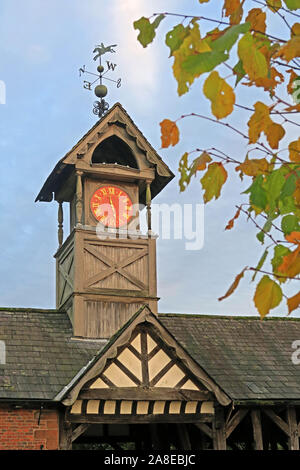 19th Century timber framed Clock Tower at Arley Hall, Arley Village, Warrington, Cheshire, England, UK, in autumn Stock Photo