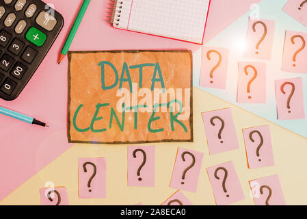 Writing note showing Data Center. Business concept for a repository that houses computing facilities like servers Mathematics stuff and writing equipm Stock Photo