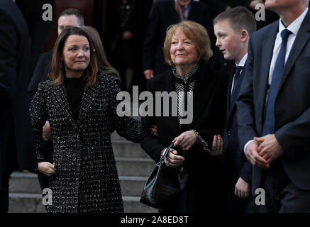 Kathleen Watkins (centre), wife of the celebrated broadcaster Gay Byrne with their daughter Suzy and grandson Cian leaving St. Mary's Pro-Cathedral in Dublin following his funeral service. Stock Photo