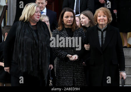 Kathleen Watkins (right), wife of the celebrated broadcaster Gay Byrne with their daughters Crona (left) and Suzy leaving St. Mary's Pro-Cathedral in Dublin following his funeral service. Stock Photo