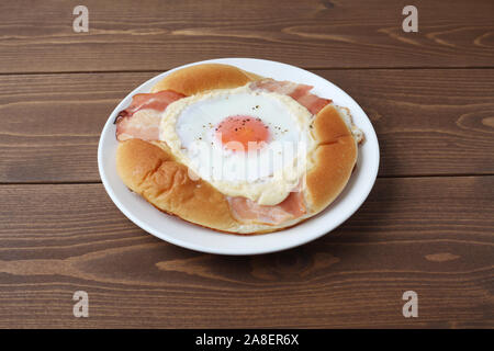 bacon egg bread on plate isolated on table Stock Photo