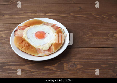 bacon egg bread on plate isolated on table Stock Photo