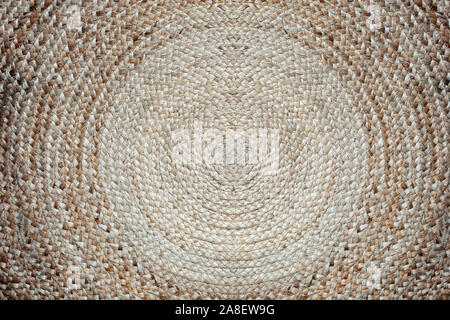 Pattern of weave mat, round wicker mat circle brown color background texture Stock Photo