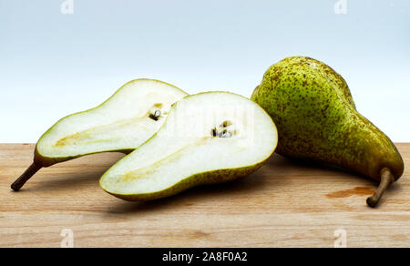 Fresh pears on the wooden table, white background Stock Photo