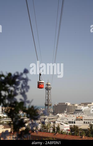 cable car riding up to the top taking in the views of Barcelona city Stock Photo