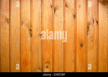 Background of wooden boards painted with stain in yellow. Stock Photo