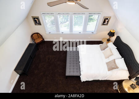 Looking down over a master bedroom from an above floor. Stock Photo
