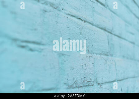 texture: old cracked brick wall painted in paint. Brick wall texture. The old wall of the building. The texture for the designer is brick with a dull Stock Photo