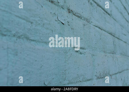 texture: old cracked brick wall painted in paint. Brick wall texture. The old wall of the building. The texture for the designer is brick with a dull Stock Photo