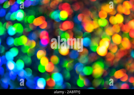 Blurred defocused multi color lights as Christmas decorations background. Party concept. Stock Photo