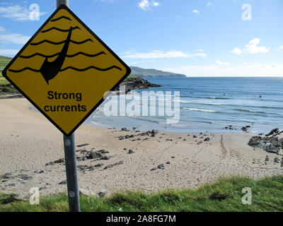 Yellow sign of strong currents on a beach frequented by surfers in County Kerry (Ireland). Caution concept Stock Photo