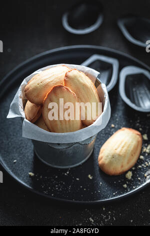 Delicious Madeleine cookies baked in a fluted tin or mould Stock Photo