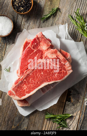 Raw Red Grass Fed T Bone Steak Ready to Cook Stock Photo
