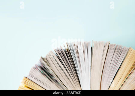 Books close up over blue background Stock Photo
