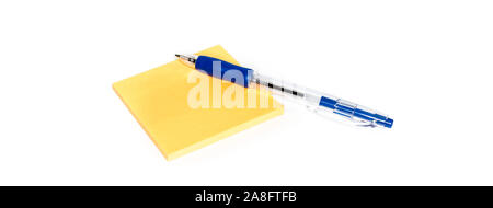 Yellow sticky notes and blue pen isolated on white background Stock Photo