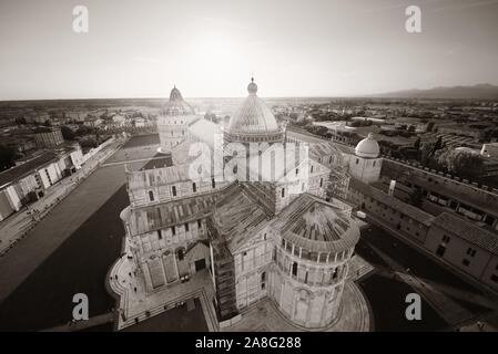 Cathedral viewed from top of Pisa leaning tower at sunset wide angle view Stock Photo