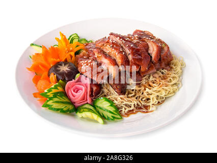 Roasted duck on Egg Noodles with sweet sauce fusion food Chinese style decorate with carved vegetables the best top ten popular of Chinese and Thailan Stock Photo