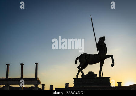 Scenic silhouette of the Centaur statue by Igor Mitoraj at Pompeii ancient city, Italy Stock Photo