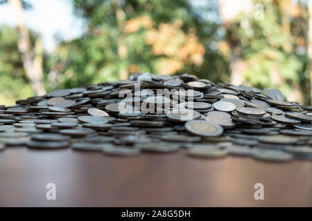 Lots coin on wooden desk with blurred background texture, Investment and saving concept, Money stack for business planning investment, A lot of money Stock Photo