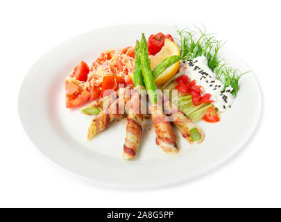 Bacon wrapped asparagus grilled with pea sprouts roll  salad on top greek yogurt sprinkle black sasemi and tomato salad on top chedda cheese decorate Stock Photo