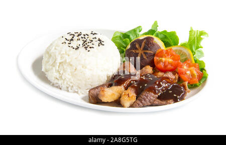 Grill Beef barbecue sauce with rice fusion food Japan style decorate with salad shitake mushrooms and tomato carved  side view  isolated on white back Stock Photo
