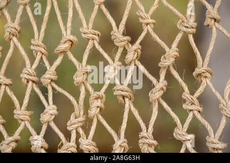 Close up of the knots on a traditional fishing net made by