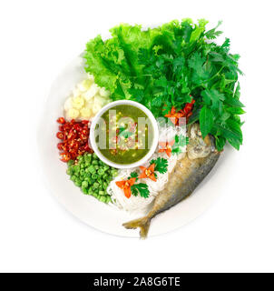 Fried mackerel (Maing-PLA-too) and fresh vegetables serving with Thai rice small noodles and seafood sauce deepping Thai appetizer salad Thai style si Stock Photo