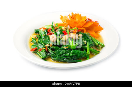 Stir fried Chinese kale in Oyster sauce with chili fusion Thai style decorate with carved carrots vegetables side view Stock Photo