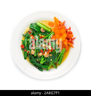 Stir fried Chinese kale in Oyster sauce with chili fusion Thai style decorate with carved carrots vegetables top view Stock Photo