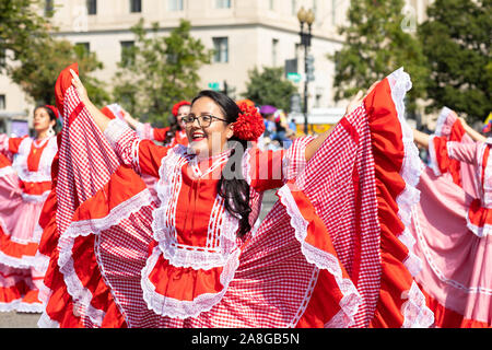 Washington DC, USA - September 21, 2019: The Fiesta DC, Colombian women wearing traditional clothing, performing Cumbia dance during the parade Stock Photo