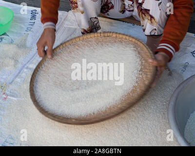 Hands Sorting Rice Stock Photo - Alamy